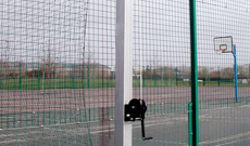 Steel tennis court dividing net posts.